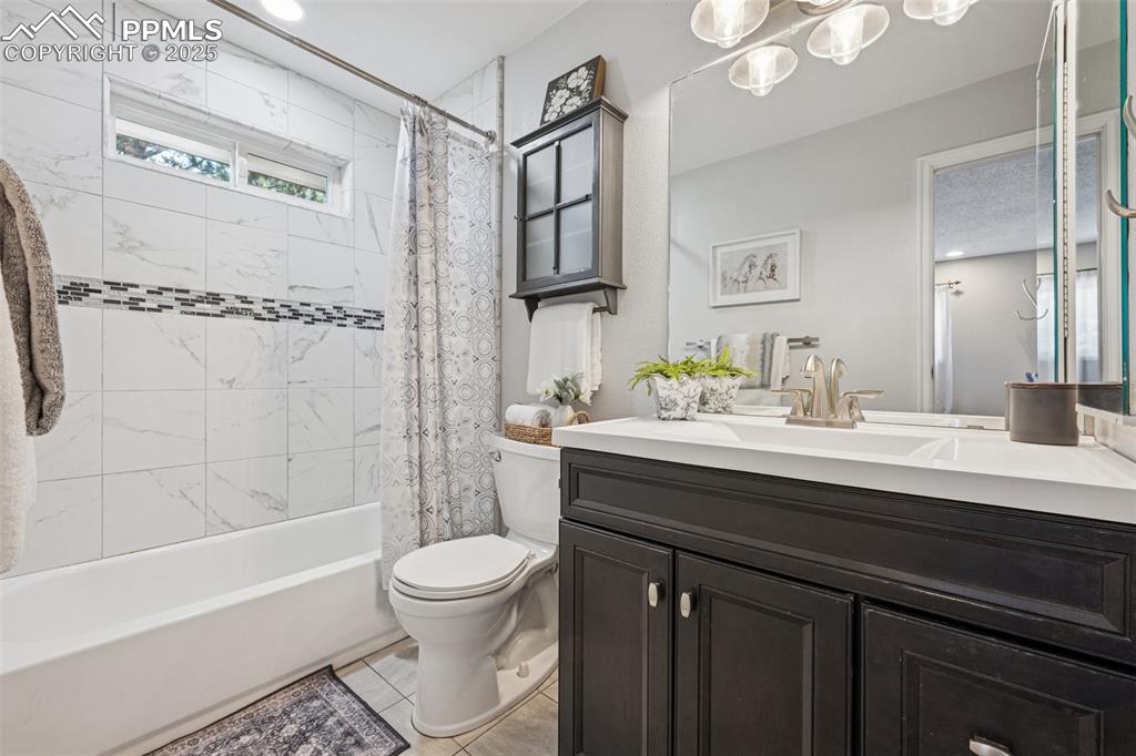 Image 21 of 44: Upper level bathroom has been updated