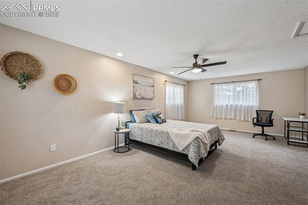 Image 23 of 44: Huge primary bedroom space for sitting area or workspace