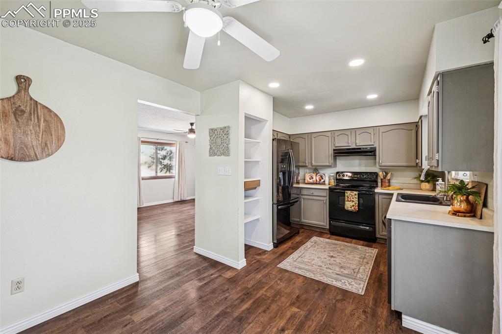 Image 3 of 44: Kitchen with dining area with slider to deck great summertime dining access