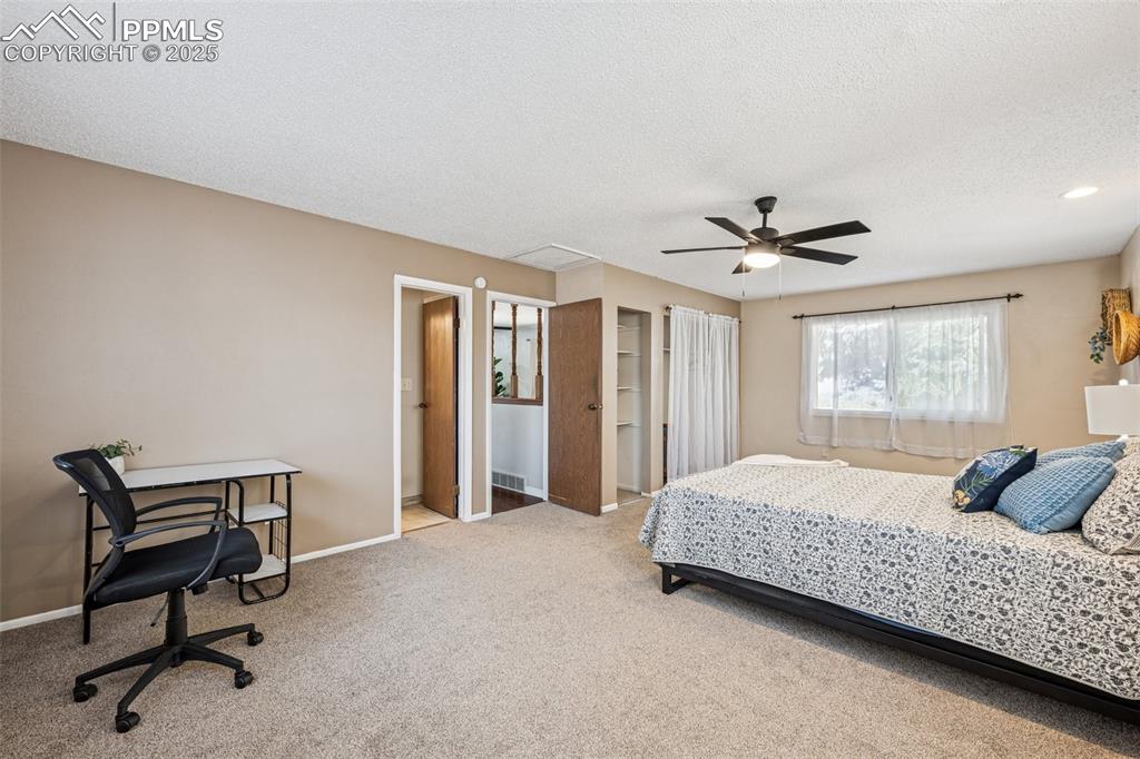 Image 4 of 44: Huge primary bedroom to fit sitting area or workspace and new carpet.