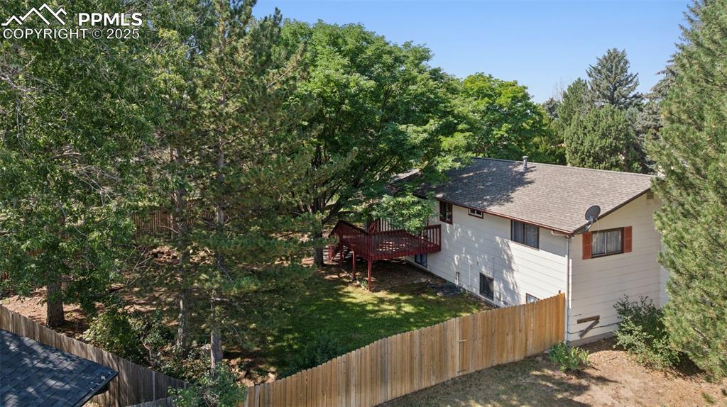 Image 41 of 44: Ariel view towards home view of front side yard and back yard.