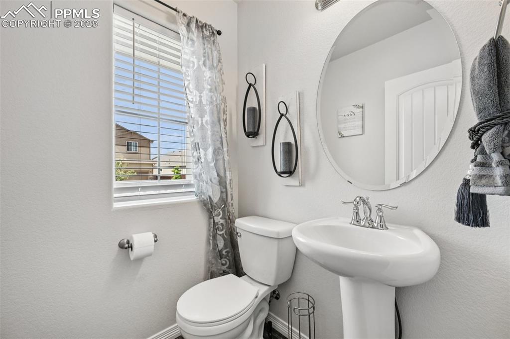 Image 20 of 44: Bathroom featuring toilet and a sink