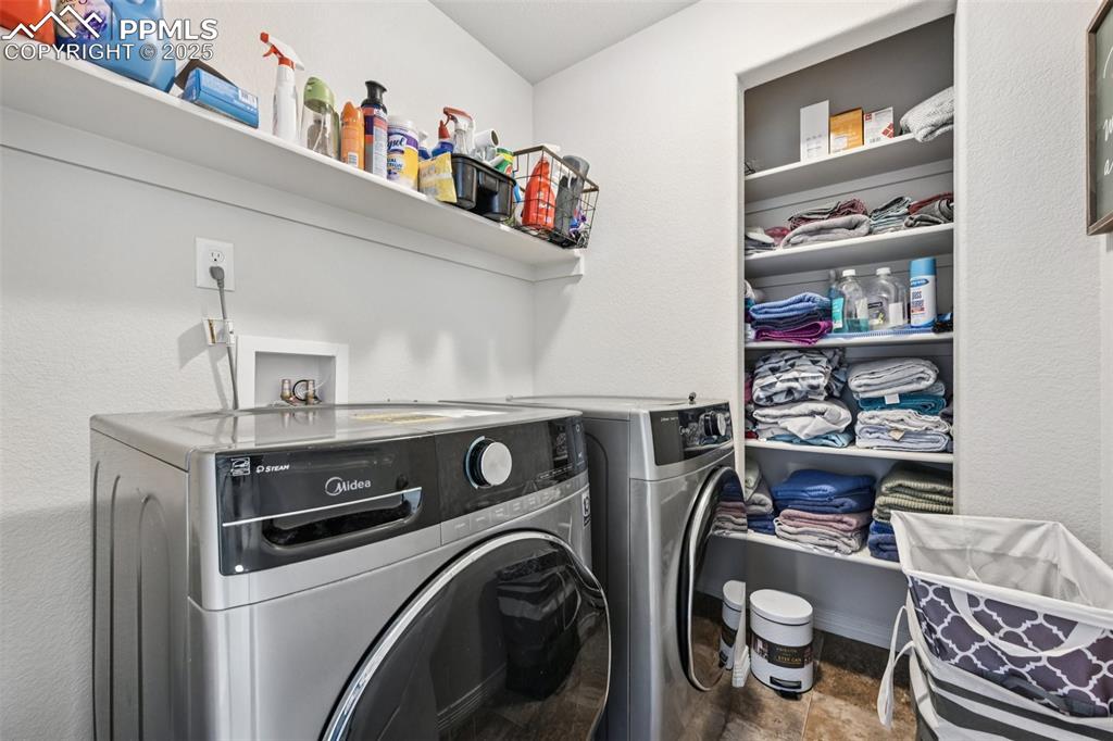 Image 35 of 44: Laundry room with independent washer and dryer