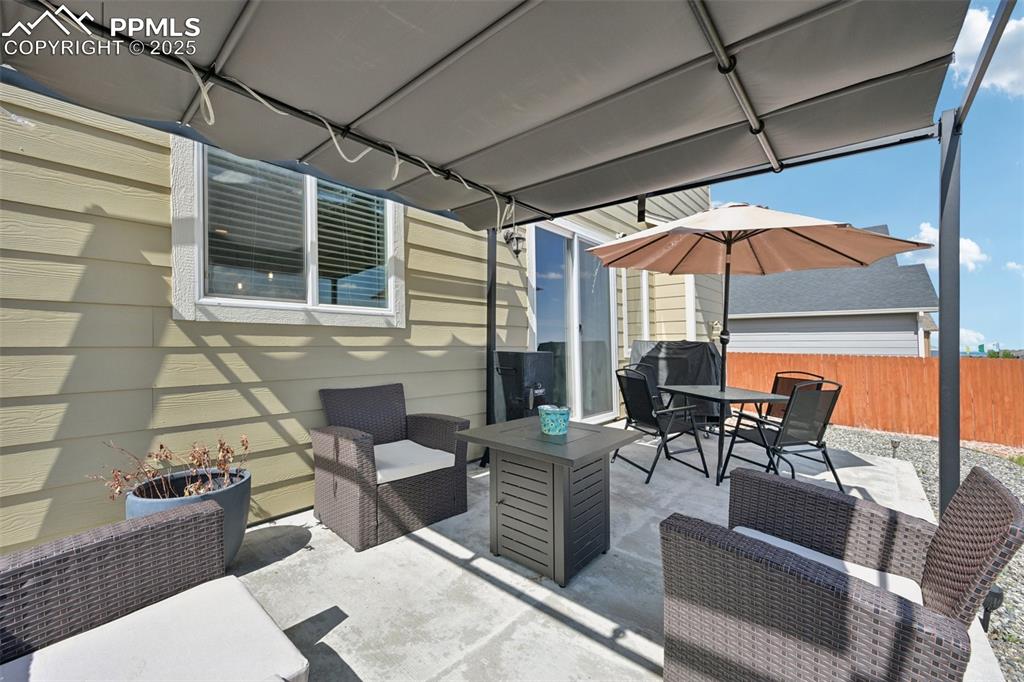 Image 37 of 44: View of patio / terrace featuring an outdoor living space and outdoor dinin