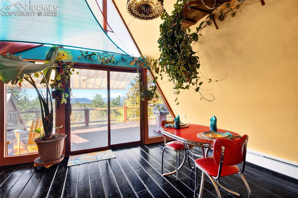 Image 10 of 42: Entryway with wood-type flooring and baseboard heating