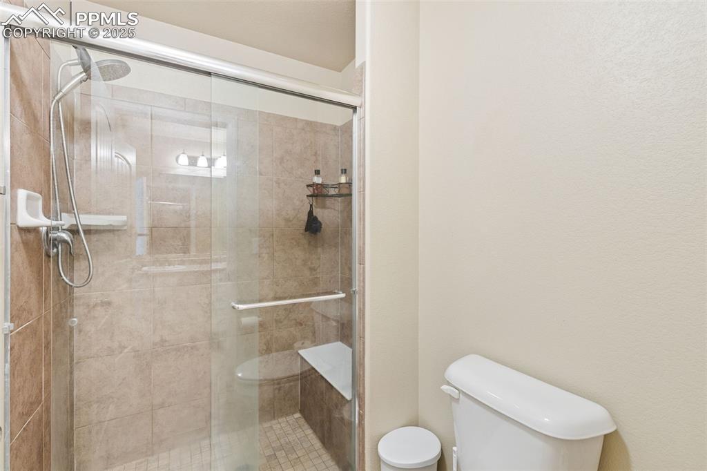 Image 11 of 33: Full bath featuring a stall shower
