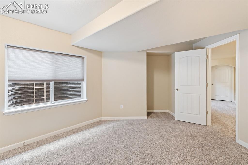 Image 19 of 33: Unfurnished room with light carpet