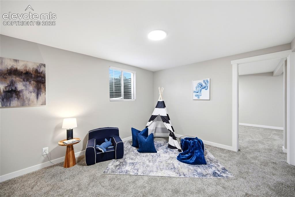 Image 17 of 26: Recessed circular light fixture, window with blinds, light gray wall paint,