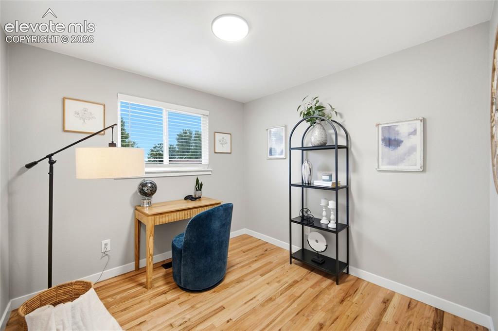 Image 9 of 26: Natural wood-finish flooring, crisp white walls, and a recessed ceiling lig