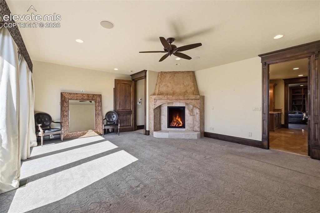Image 20 of 49: Fireplace in primary bedroom