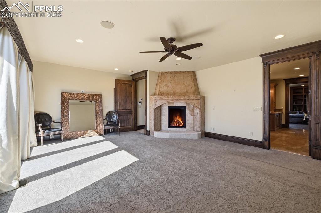 Image 22 of 49: Fireplace in primary bedroom