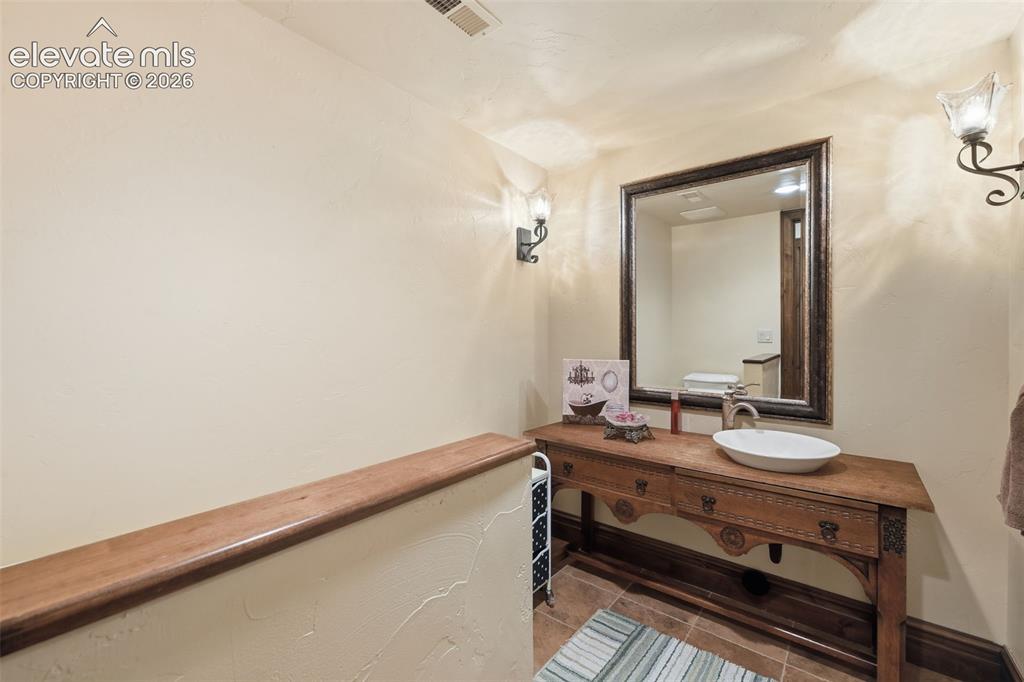 Image 34 of 49: half bath in basement