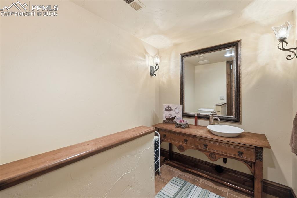 Image 36 of 49: half bath in basement