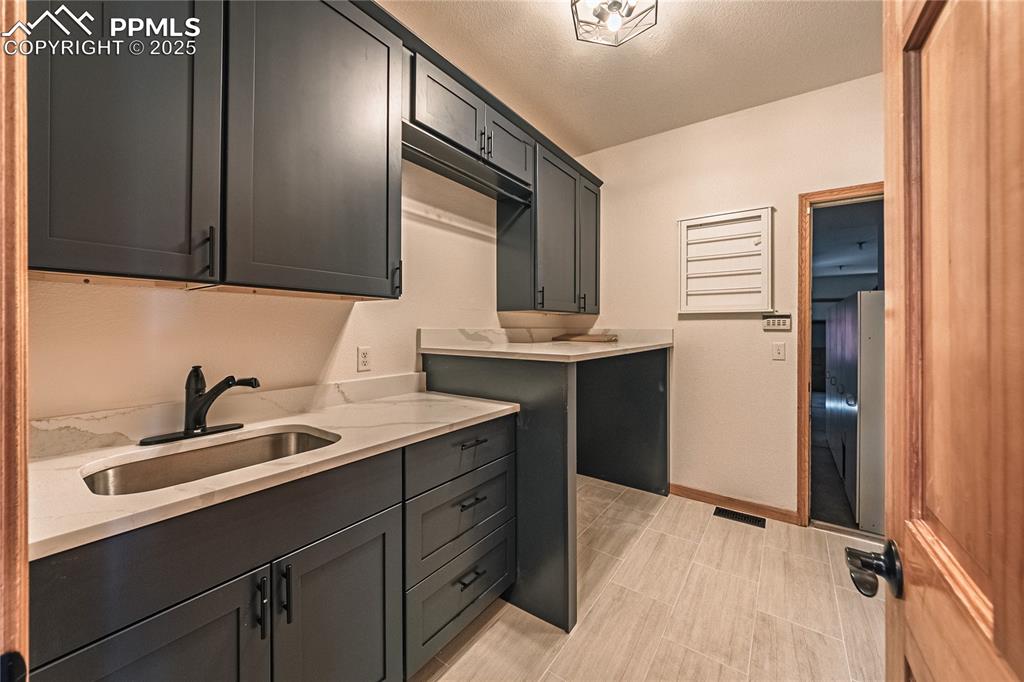 Image 26 of 45: Main floor laundry