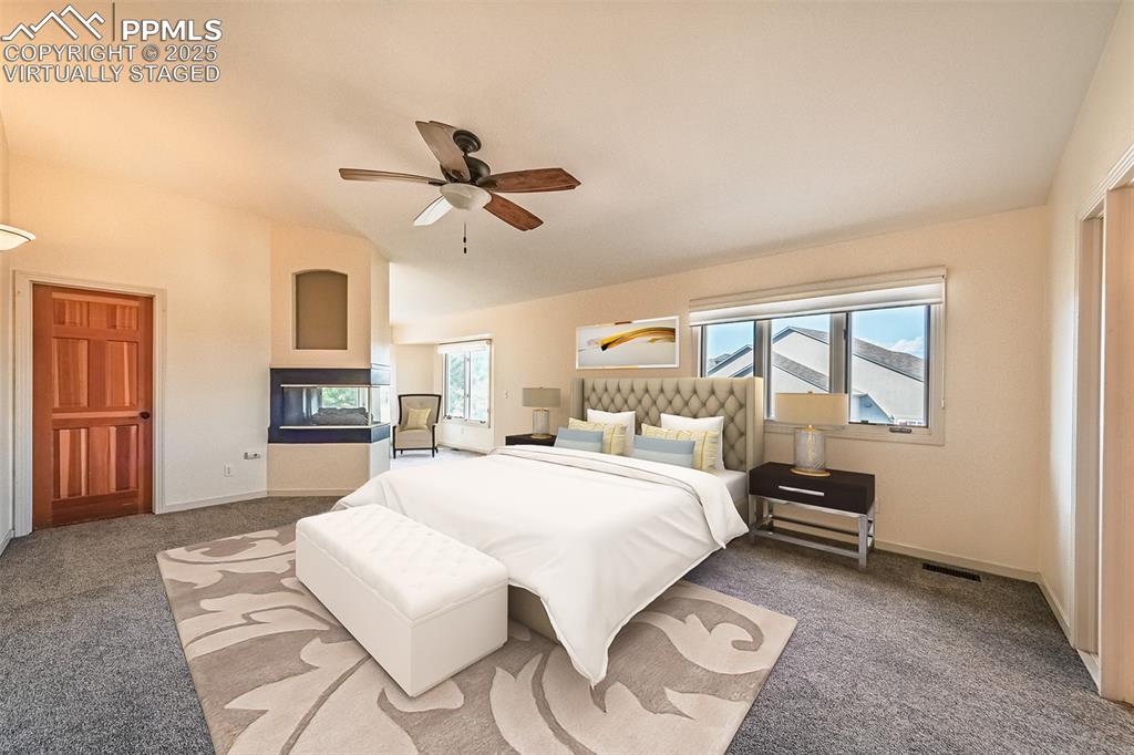 Image 27 of 45: Virtually Staged
Bedroom with carpet floors and a ceiling fan