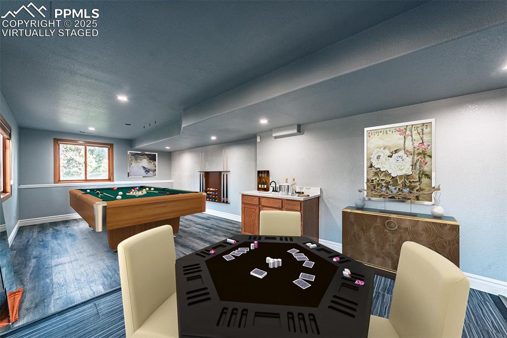 Image 38 of 45: Virtually Staged
Playroom with pool table, wood finished floors, recessed 