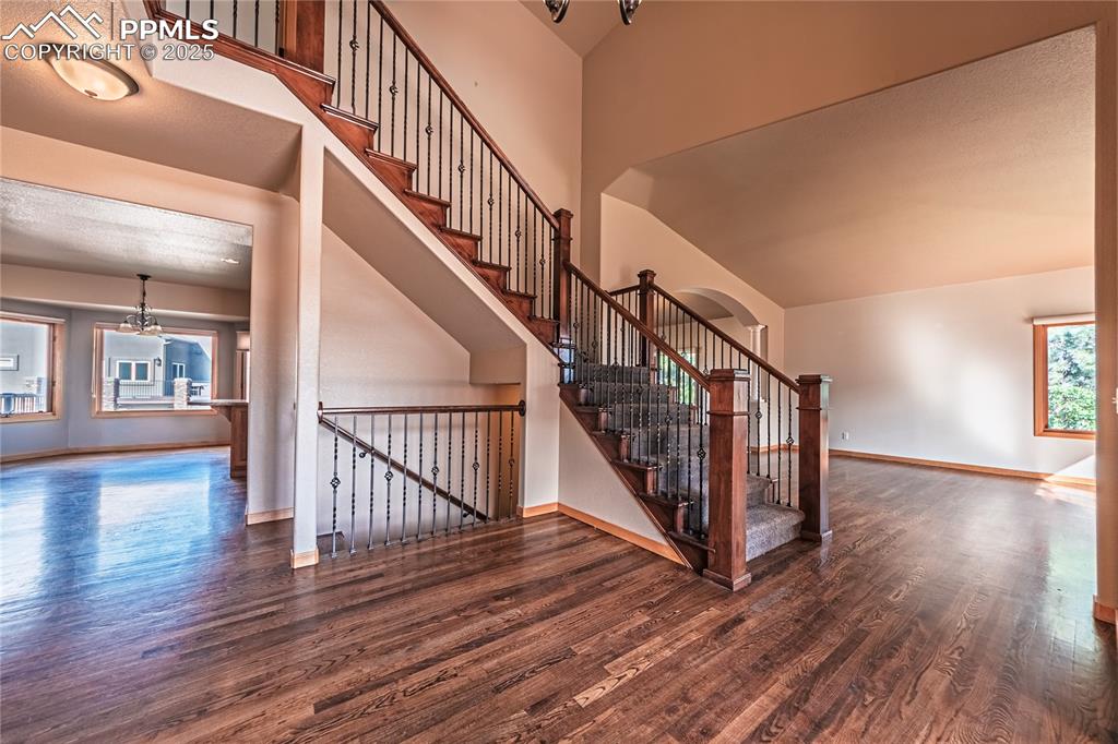 Image 4 of 45: Welcoming entryway with hardwood flooring and a
decorative light fixture, 