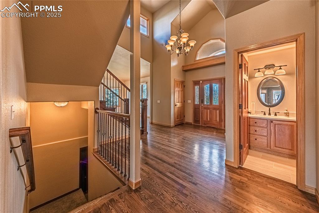 Image 5 of 45: View to front door and entry bath