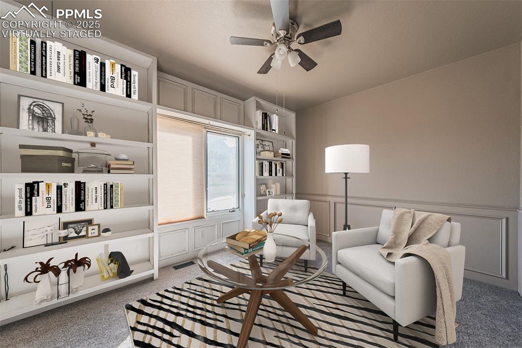 Image 6 of 45: Virtually Staged
Carpet, wainscoting, built in books shelves and ceiling f