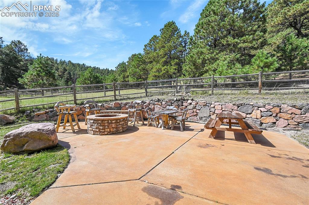 Image 10 of 50: patio with firepit