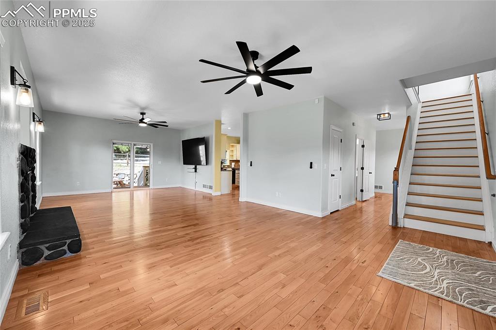 Image 14 of 50: one of two stairways to upper level