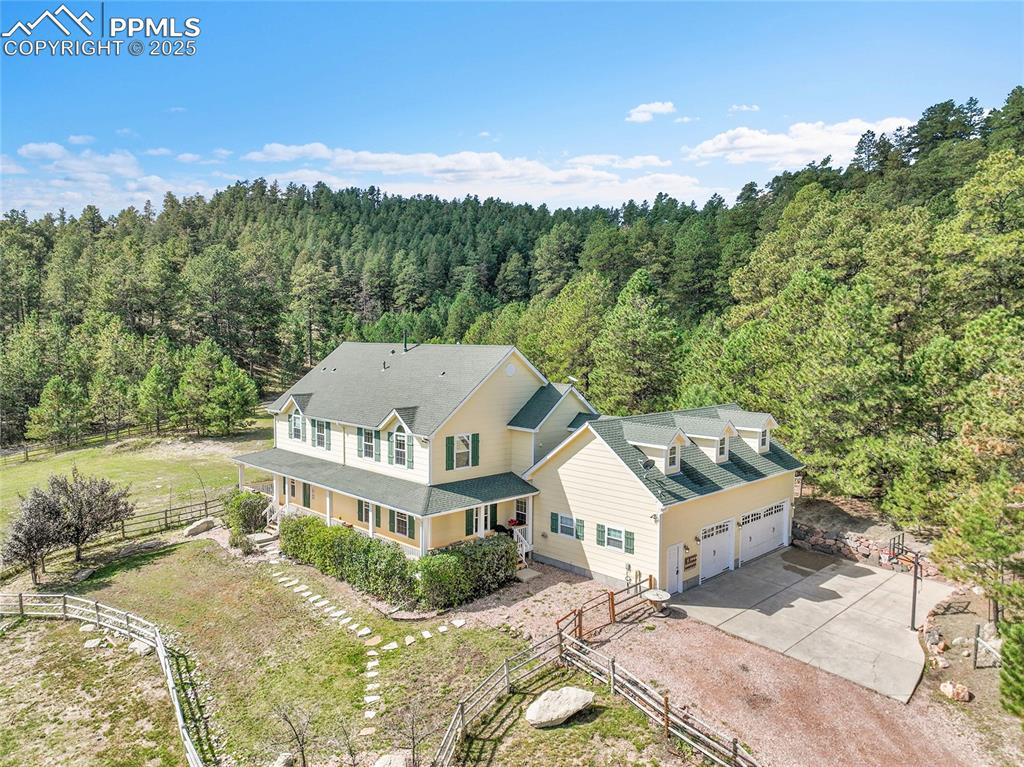 Image 3 of 50: 5 acre lot with meadow and trees