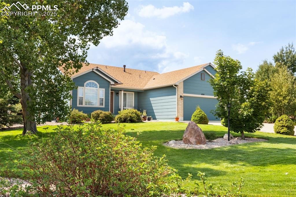 Caption: Beautifully Landscaped Front Yard