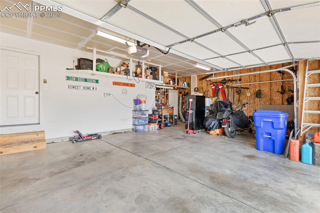 Image 43 of 47: 3 car garage w/ backyard access