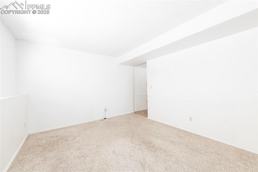 Image 15 of 25: Lower level non-conforming bedroom