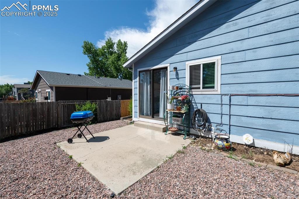 Image 19 of 25: View of patio with grilling area