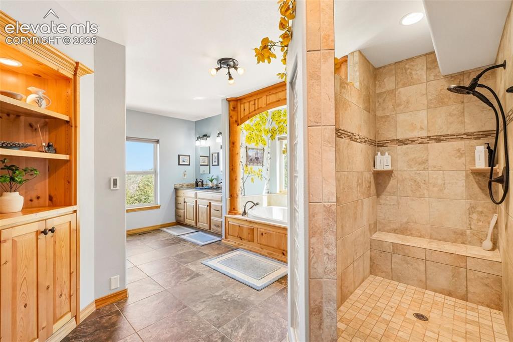 Image 31 of 50: View of the en suite 5 piece primary bathroom