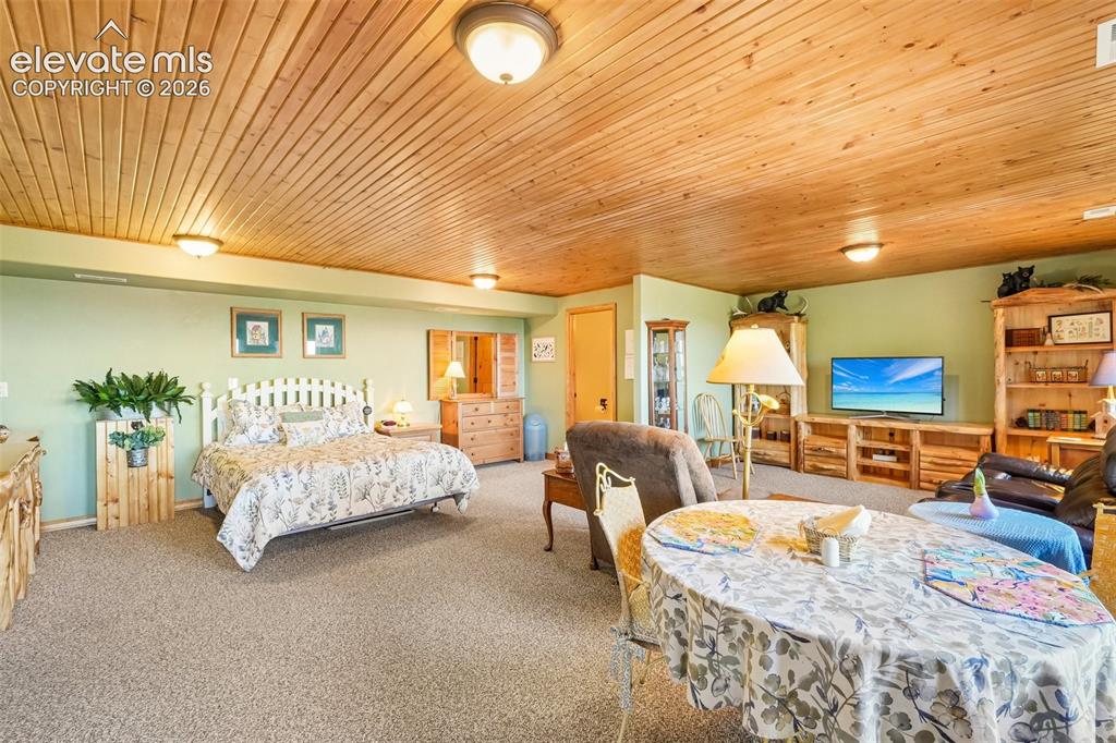 Image 32 of 50: Bedroom 2/ In-law suite on lower level with en suite 3/4 bathroom, a large