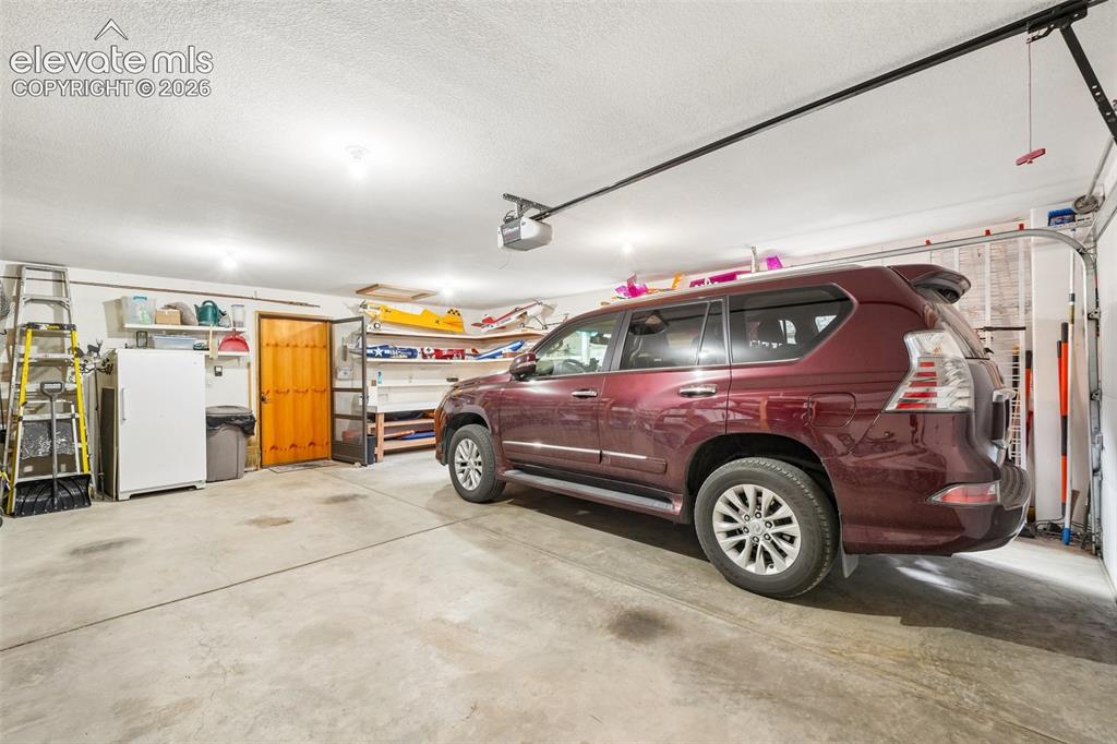 Image 49 of 50: 2 car oversized garage with workbench