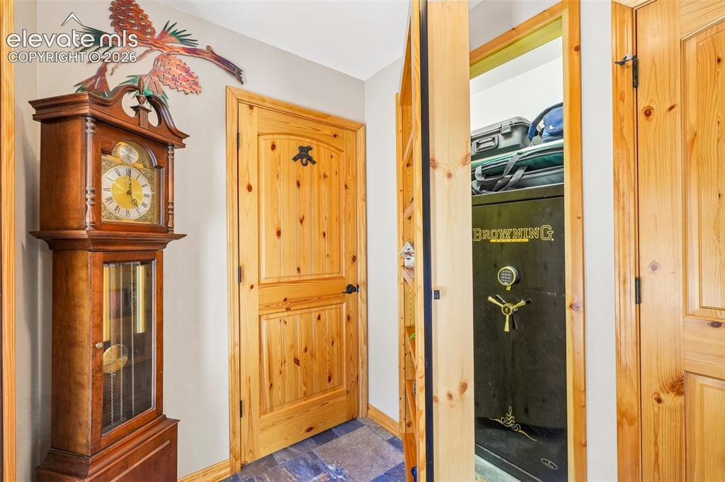 Image 7 of 50: Foyer looking at the 3/4 bathroom and the secret safe room hidden behind a