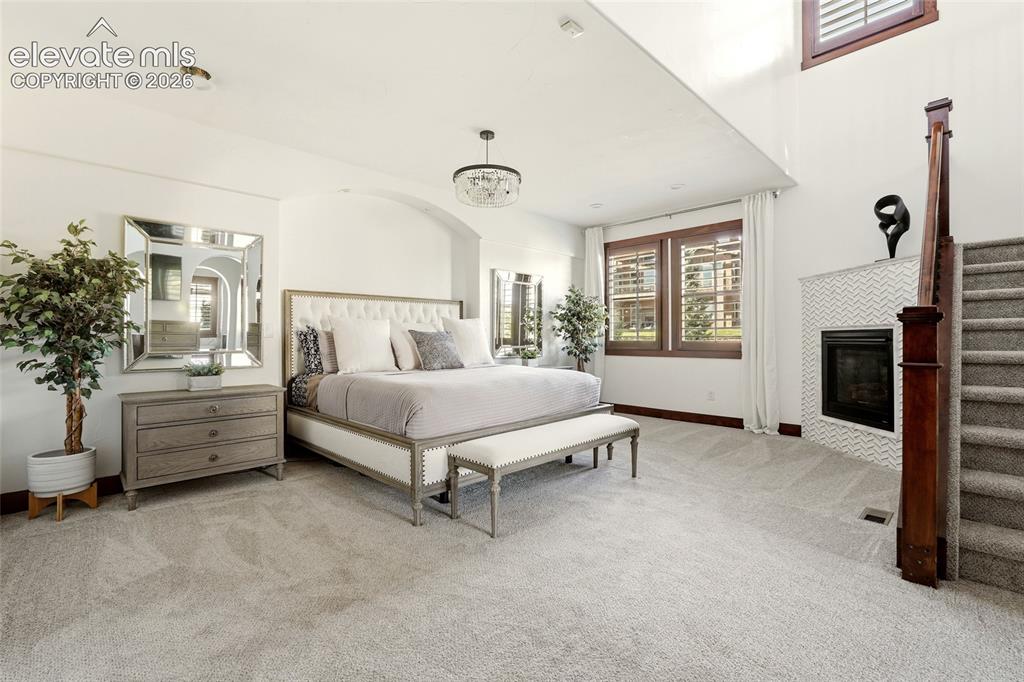 Image 18 of 46: Main level primary bedroom with private loft