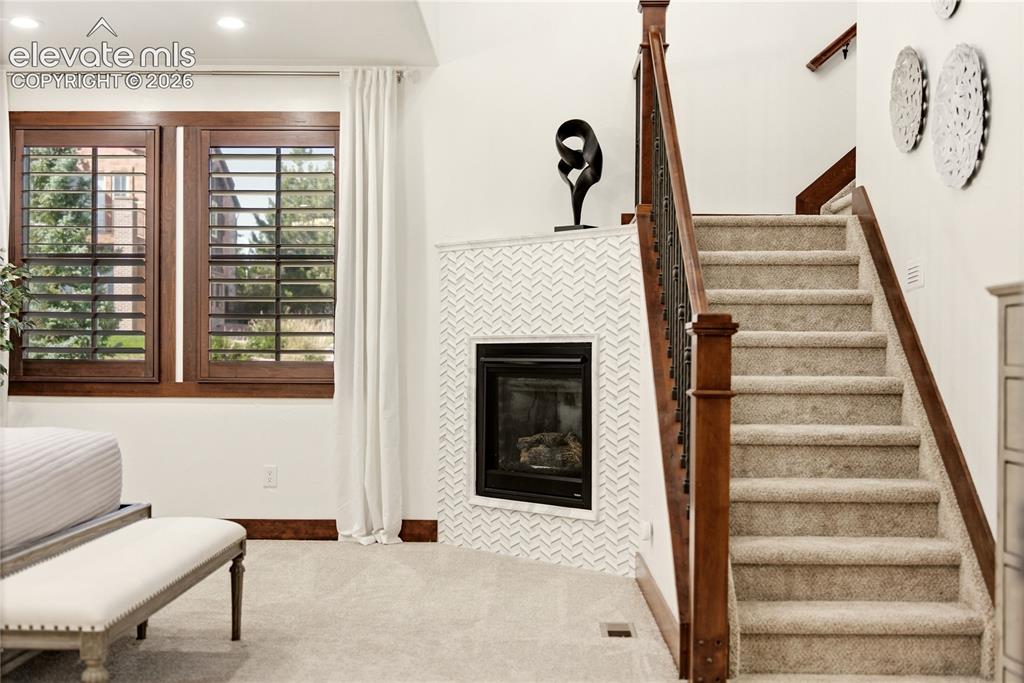 Image 21 of 46: Gas fireplace in primary bedroom