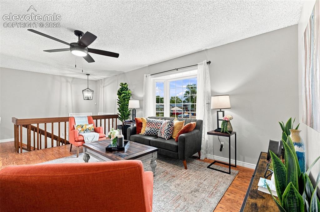 Image 11 of 33: View towards entry new light fixture and ceiling fan