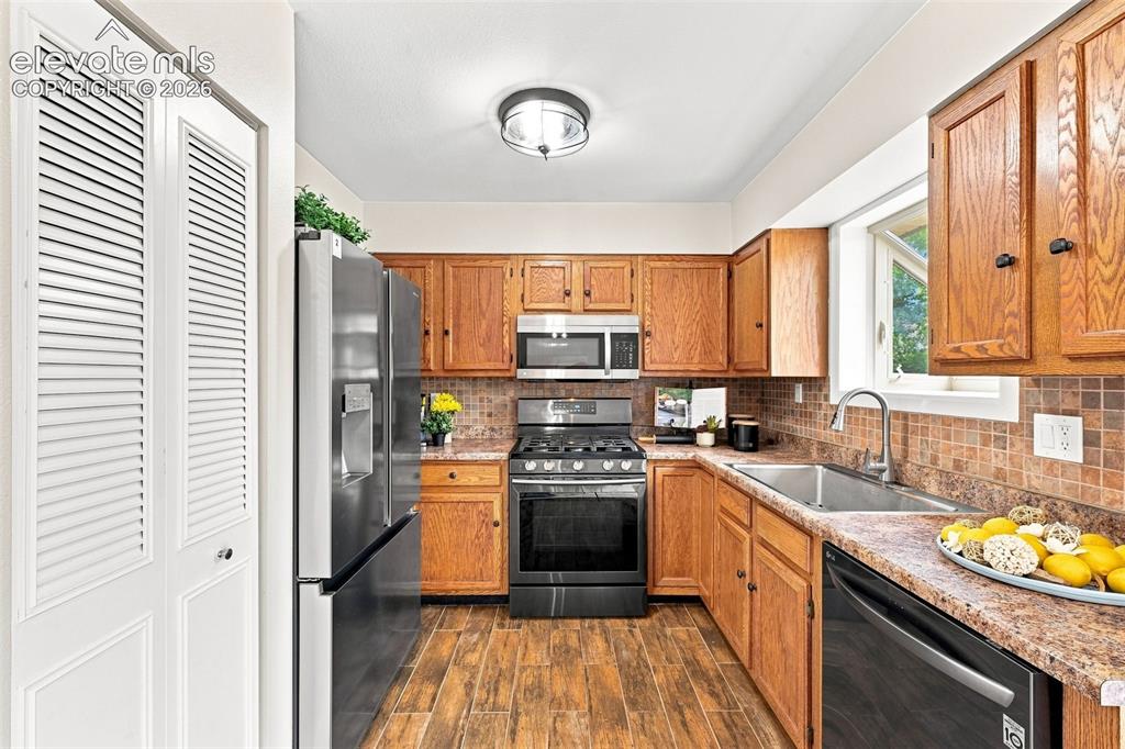 Image 12 of 33: another view showing new light fixture and garden window to the right