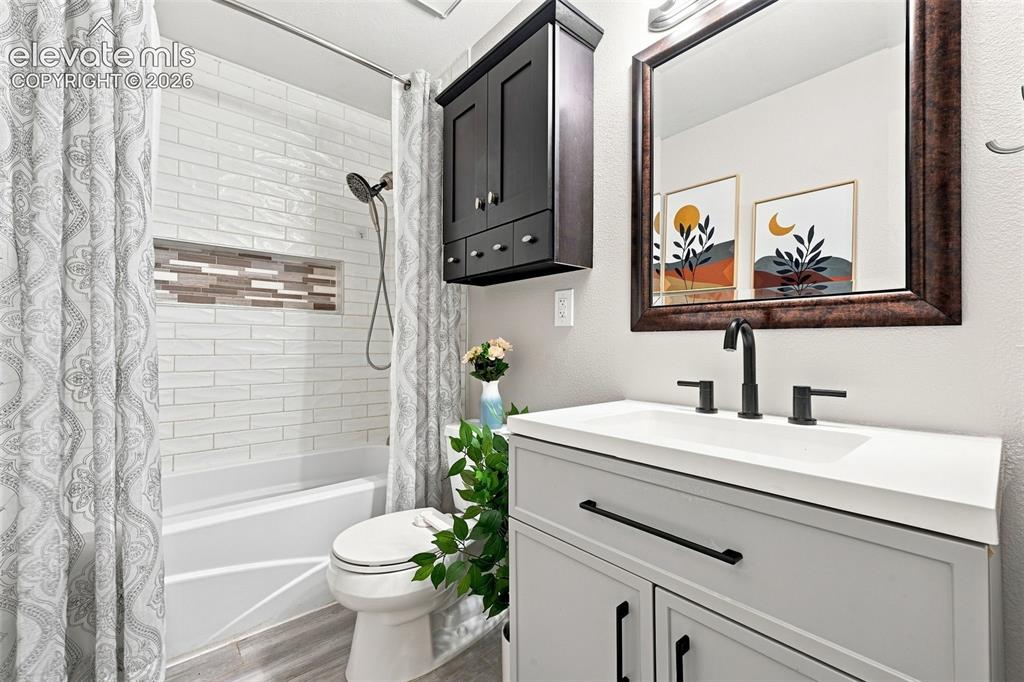 Image 15 of 33: Upper level bathroom, adjoining door to primary bathroom, new vanity, updat
