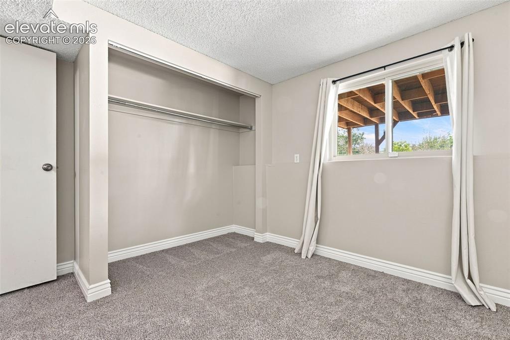 Image 24 of 33: Lower Level 3rd Bedroom