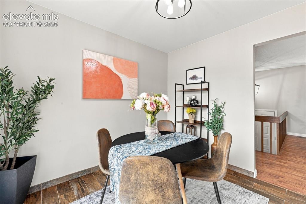 Image 6 of 33: Dining area in kitchen with walk out to back deck