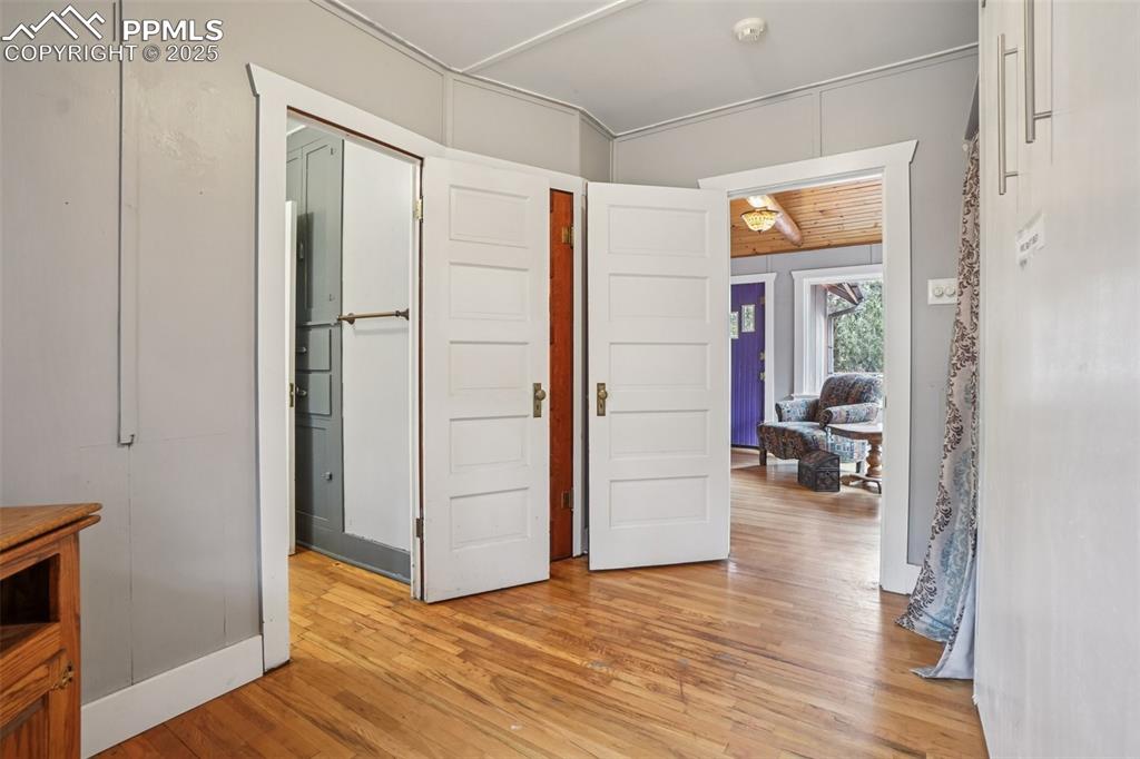 Image 15 of 43: Bedroom 3 off living room with Murphy bed and attached full bathroom