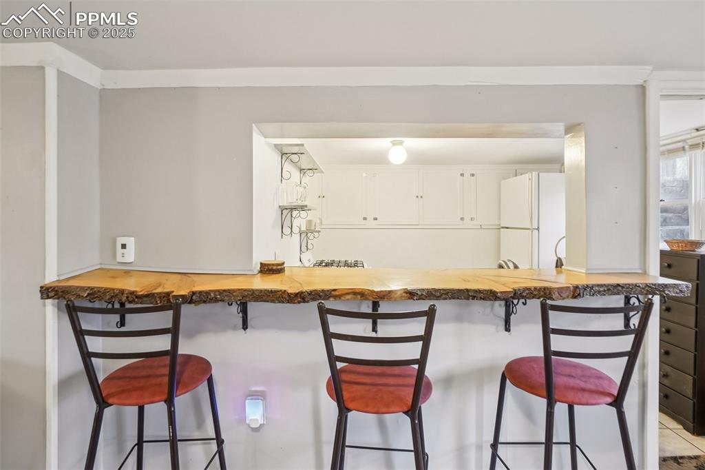 Image 29 of 43: Live edge Breakfast Bar