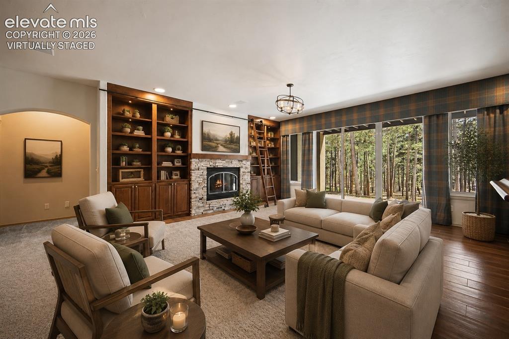 Image 22 of 42: Virtually Staged
Fireplace, built ins, stacked stone