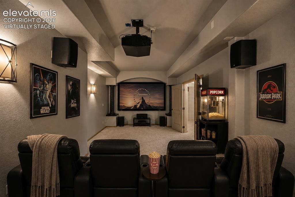 Image 31 of 42: Virtually Staged
Home Theater Room featuring tiered seating with rolled-ar