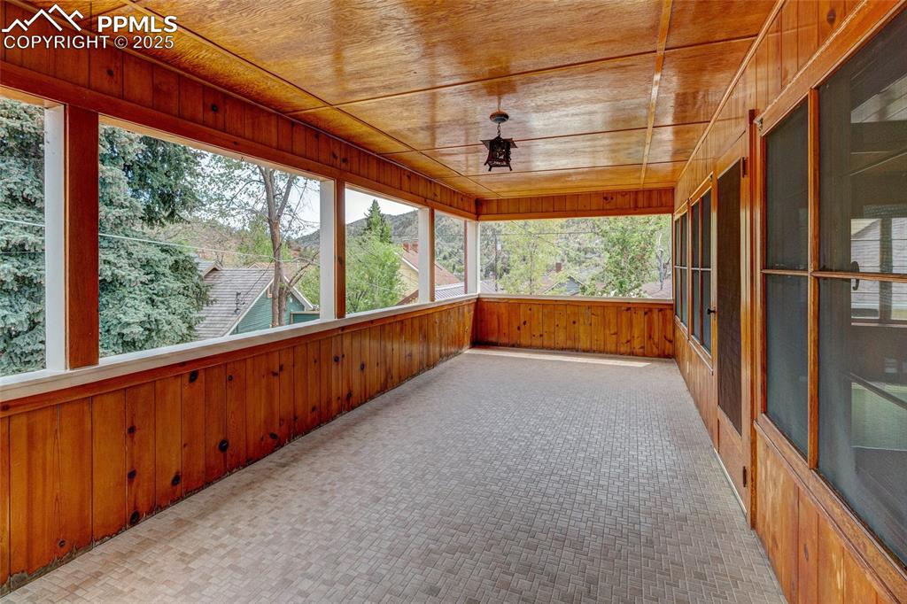 Image 20 of 37: Amazing back porch with mountain views.