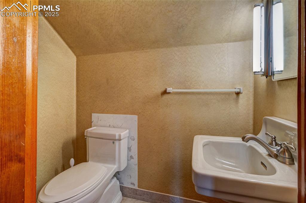 Image 33 of 37: Half bath on upper level