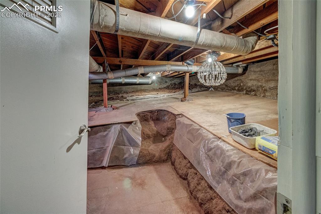 Image 35 of 37: Extra storage in crawl space