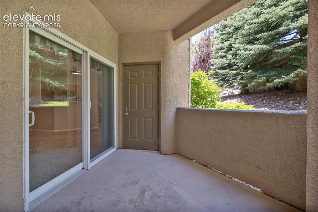 Image 22 of 43: Covered patio with storage closet