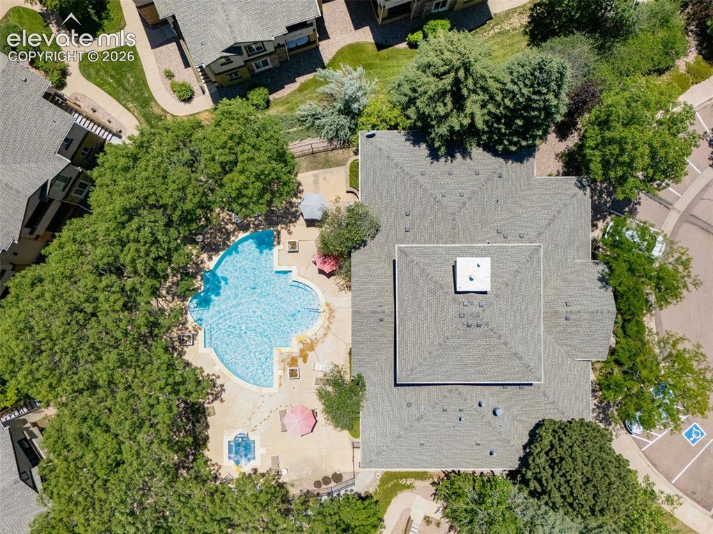 Image 39 of 43: Clubhouse with pool and hot tub